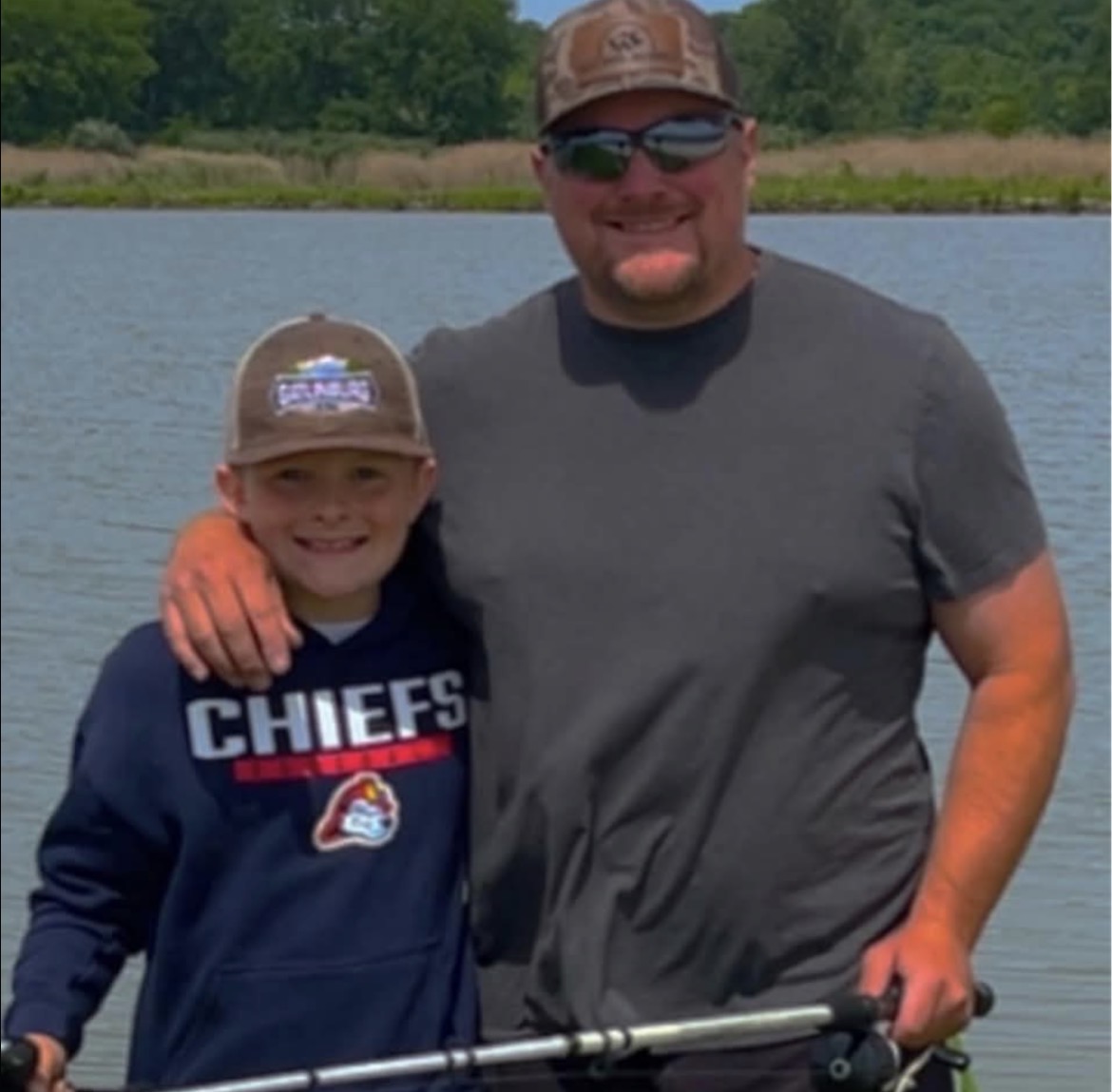 Father and son spending time together by the water